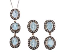 A diamond and blue topaz earpendents and pendant  A diamond and blue topaz earpendents and