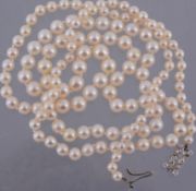 A graduated cultured pearl necklace, composed of one hundred and thirty four 4  A graduated cultured