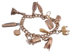 A charm bracelet, composed of curb links, with attached charms including a 9...  A charm bracelet,