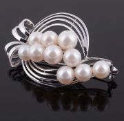 Mikimoto, a cultured pearl brooch, the pierced bow shaped setting with a...  Mikimoto, a cultured