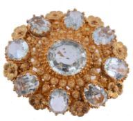 A 19th century French gold and aquamarine cannetille brooch, circa 1830  A 19th century French