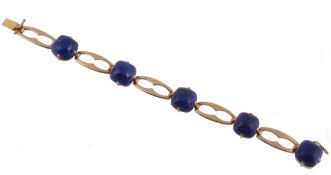 A lapis lazuli bracelet, the squared cabochon lapis lazuli claw set with...  A lapis lazuli