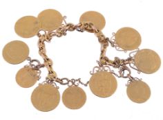A gold anchor link coin bracelet, suspending eight soldered spade guineas  A gold anchor link coin