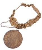 A fancy link gold bracelet, the pierced Celtic cross circular panels...  A fancy link gold bracelet,