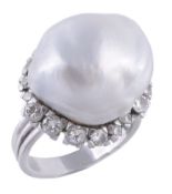 A baroque cultured pearl and diamond cluster ring  A baroque cultured pearl and diamond cluster ring
