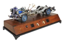 A motor vehicle demonstration chassis, a fine mains electricity powered working model, circa 1954, b