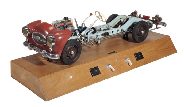 A motor vehicle demonstration chassis, a similar, but later electrically powered working model to