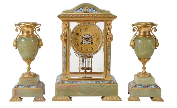 A French gilt brass and champleve enamel mounted green onyx four-glass mantel clock garniture, The