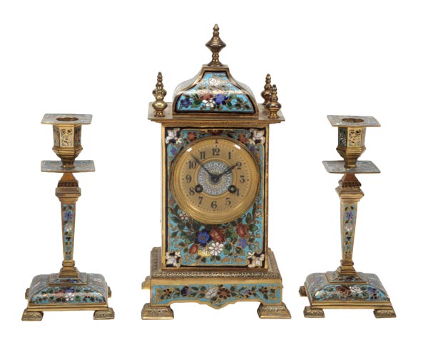 A French gilt brass and champleve enamel mantel clock garniture, Unsigned, circa 1900, The circular