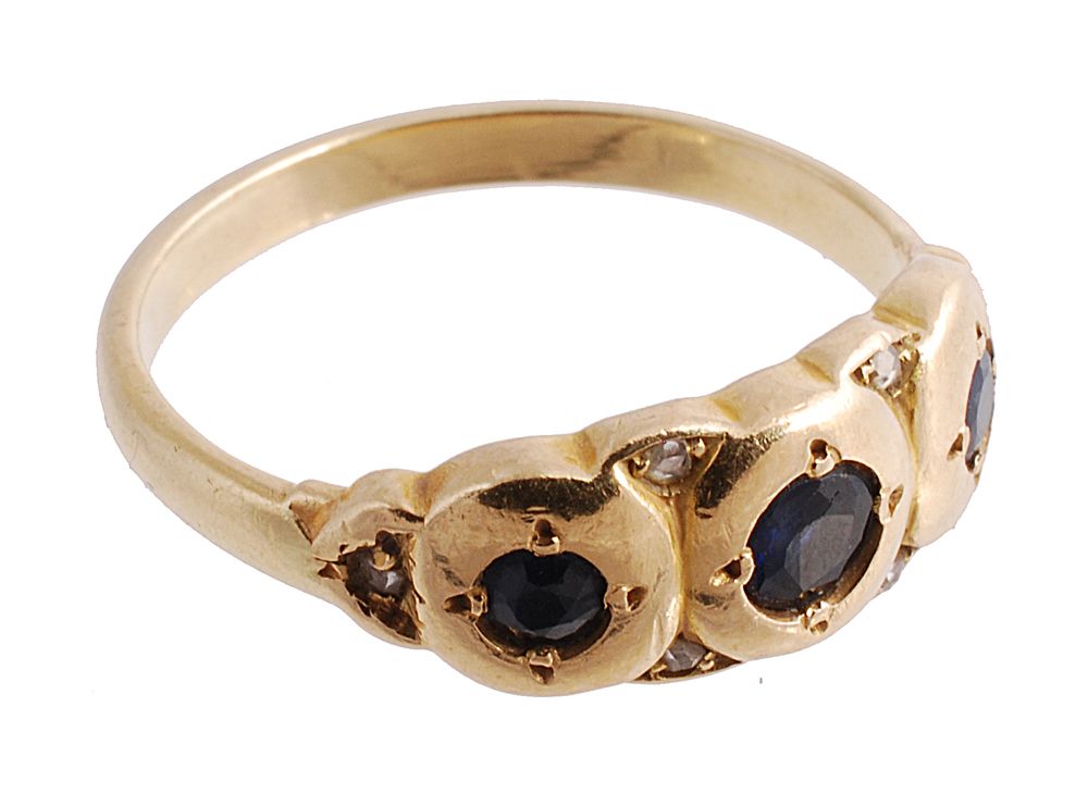 A sapphire and diamond ring, the three circular cut sapphires with rose cut...  A sapphire and