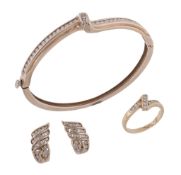 A diamond bangle, the hinged bangle with a twist detail  A diamond bangle,   the hinged bangle