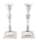 A pair of Edwardian silver candlesticks by Thomas A  A pair of Edwardian silver candlesticks by
