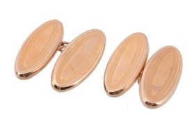 A pair of gold coloured double sided cufflinks  A pair of gold coloured double sided cufflinks,