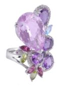 A multi gem set ring, the pear shaped kunzite in a three claw setting  A multi gem set ring,   the