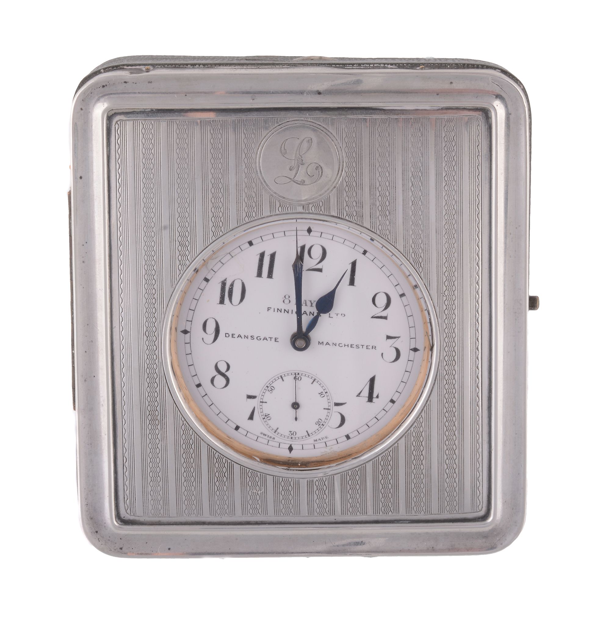 Finnigan`s Ltd, Deansgate, Manchester, a silver mounted travelling clock...  Finnigan`s Ltd,
