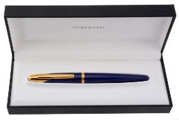 Dunhill, a blue resin fountain pen, the blue resin cap and barrel with gilt...  Dunhill, a blue