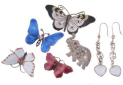 Four enamelled butterfly brooches, the first by Marius Hammer with white  Four enamelled butterfly