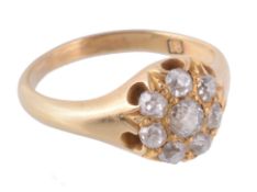 A diamond cluster ring, the central old cut diamond within a surround of old...  A diamond cluster