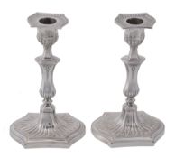 A pair of late Victorian silver candlesticks by Hawksworth, Eyre & Co. Ltd  A pair of late Victorian
