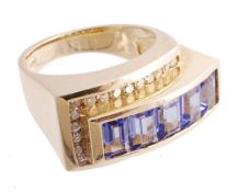 A sapphire and diamond ring, the rectangular step cut sapphires in a raised...  A sapphire and