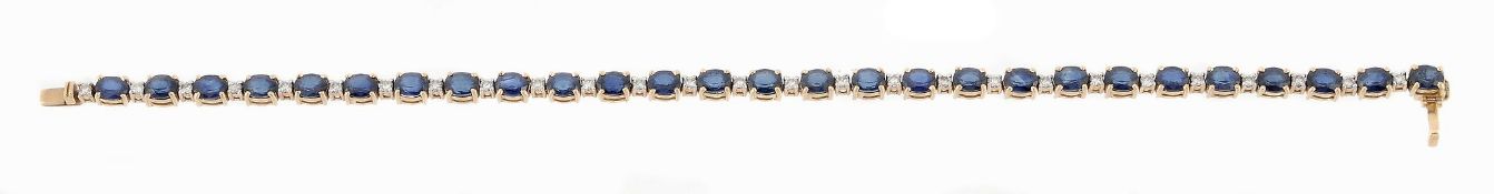 A sapphire and diamond bracelet, set with alternating oval shaped sapphires...  A sapphire and