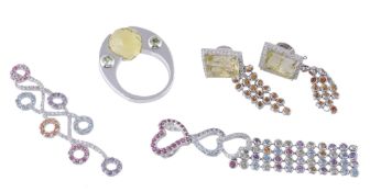 A multi gem set pendant, set with vari coloured gemstones and brilliant cut...  A multi gem set