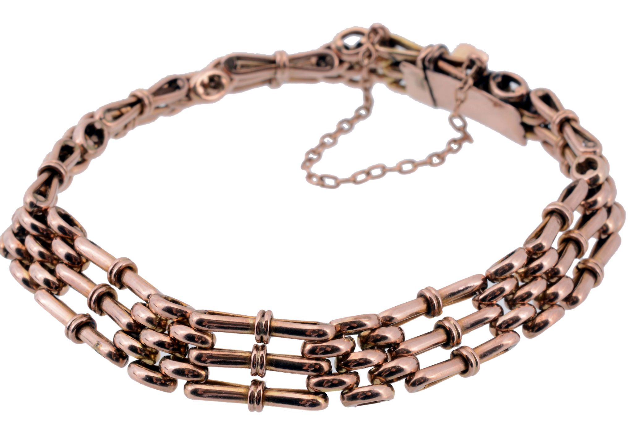 A gold coloured gate link bracelet, composed of fancy gate links  A gold coloured gate link