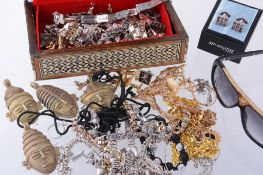 A quantity of costume jewellery, to include a gold coloured metal ring  A quantity of costume