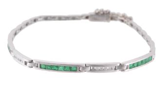 A diamond and emerald bracelet , the bracelet with five alternating channel...  A diamond and