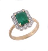 An 18 carat gold emerald and diamond ring, London 2002  An 18 carat gold emerald and diamond ring,