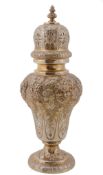 An Edwardian silver gilt large inverted baluster sugar caster by James...  An Edwardian silver