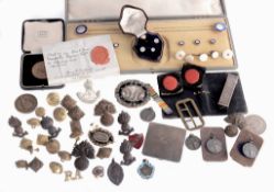 A small collection of objects, including: an incomplete boxed button and...  A small collection of