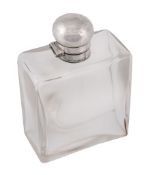 A silver topped rectangular clear glass spirit flask by Asprey & Co  A silver topped rectangular