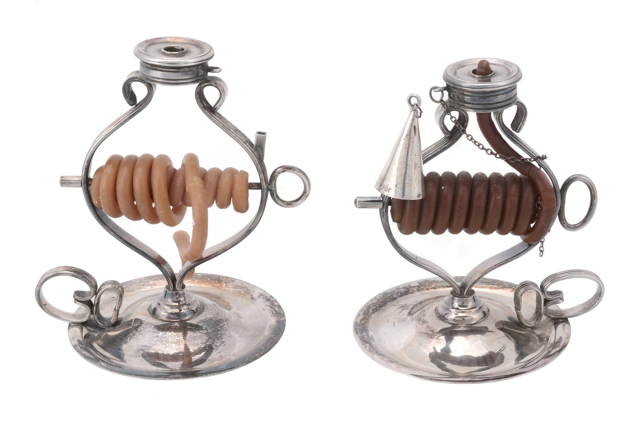 Two electro-plated wax jacks, the reeded frames on circular bases with...  Two electro-plated wax