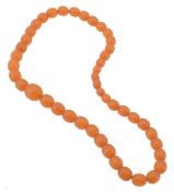 A single strand amber bead necklace, composed of forty three 8mm to 16mm...  A single strand amber