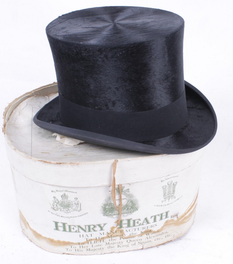 A black silk top hat by Henry Heath of London, with original box (condition of the hat is good,