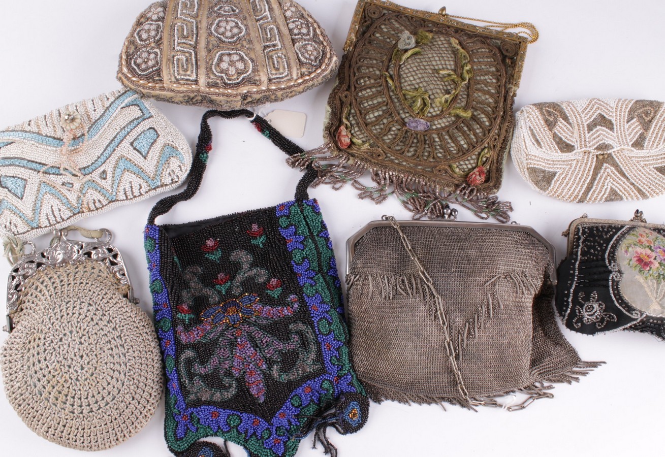 A collection of late 19th and early 20th century evening bags and purses, comprising: a pale green