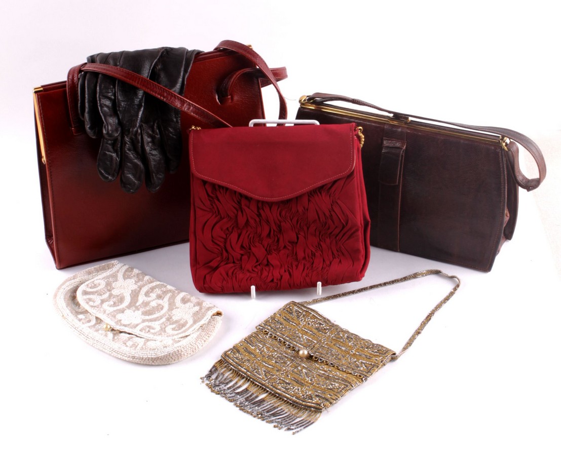 An early 20th century cut steel and beaded envelope style evening bag; together with a later white