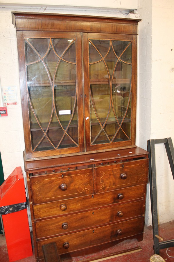 A 19th Century mahogany secretaire bookcase with astragal glazed doors enclosing adjustable shelves