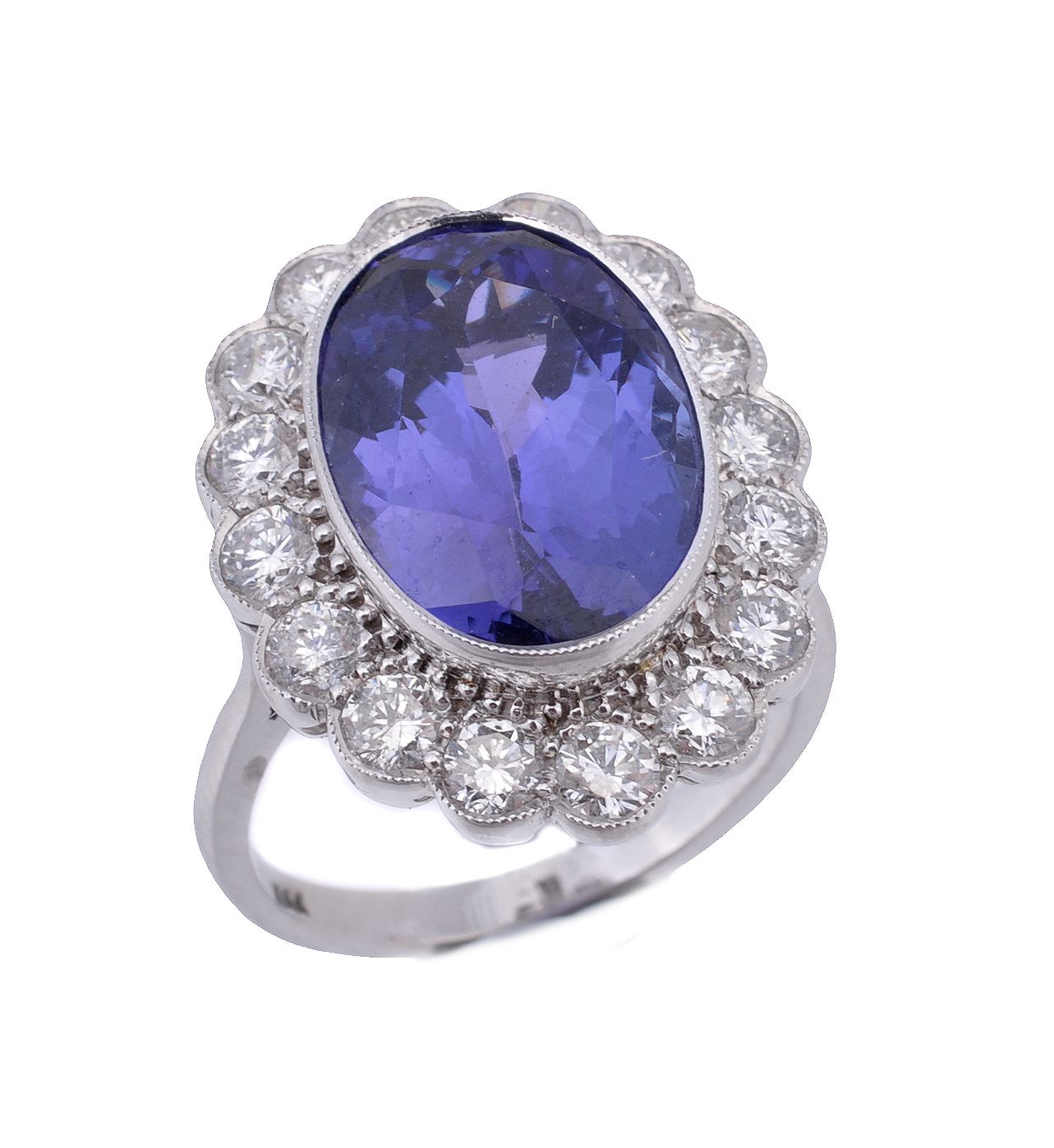 A tanzanite and diamond ring, the central oval cut tanzanite in a collet...  A tanzanite and diamond