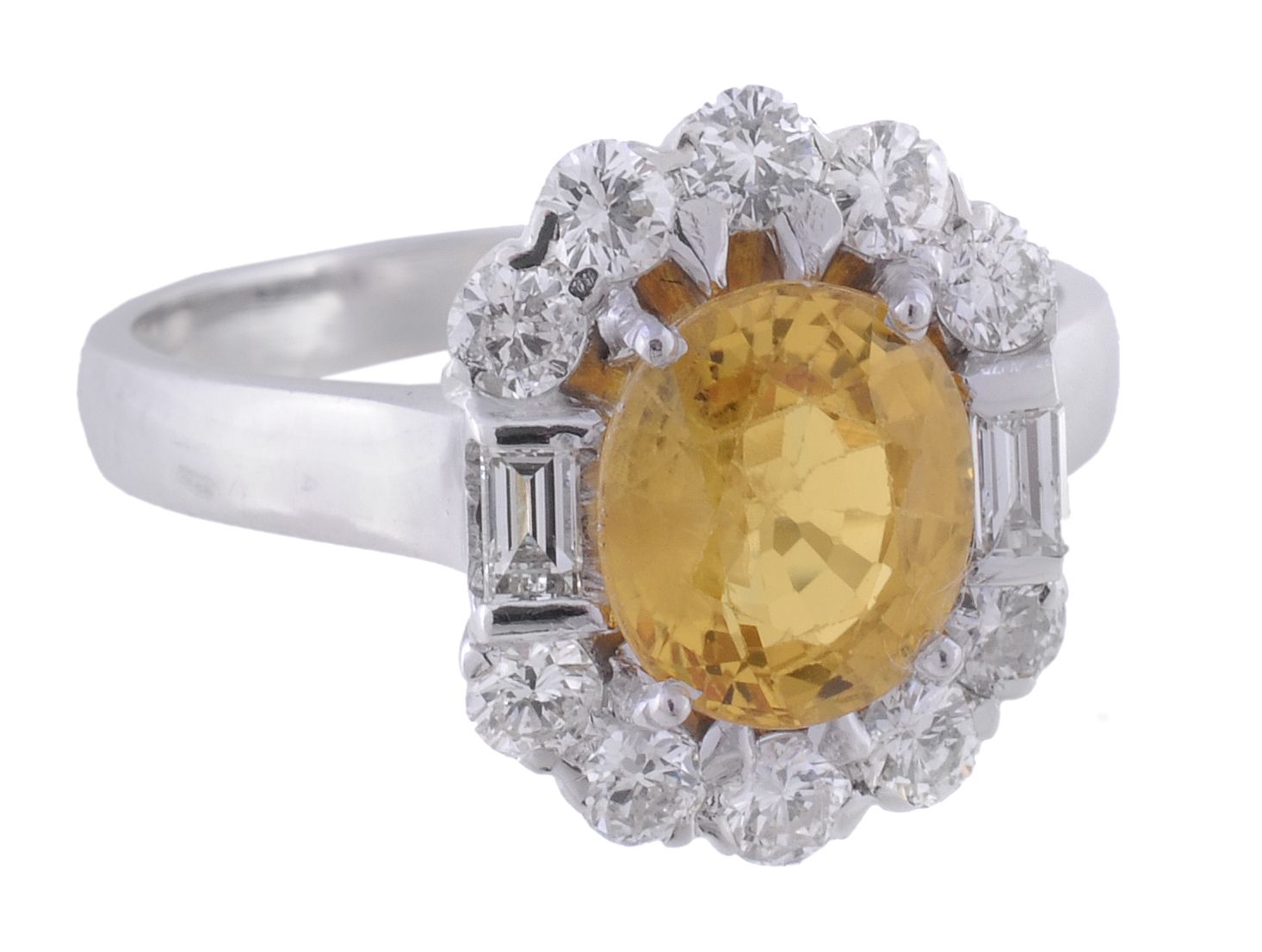 An 18 carat gold yellow sapphire and diamond ring, London 2014  An 18 carat gold yellow sapphire and