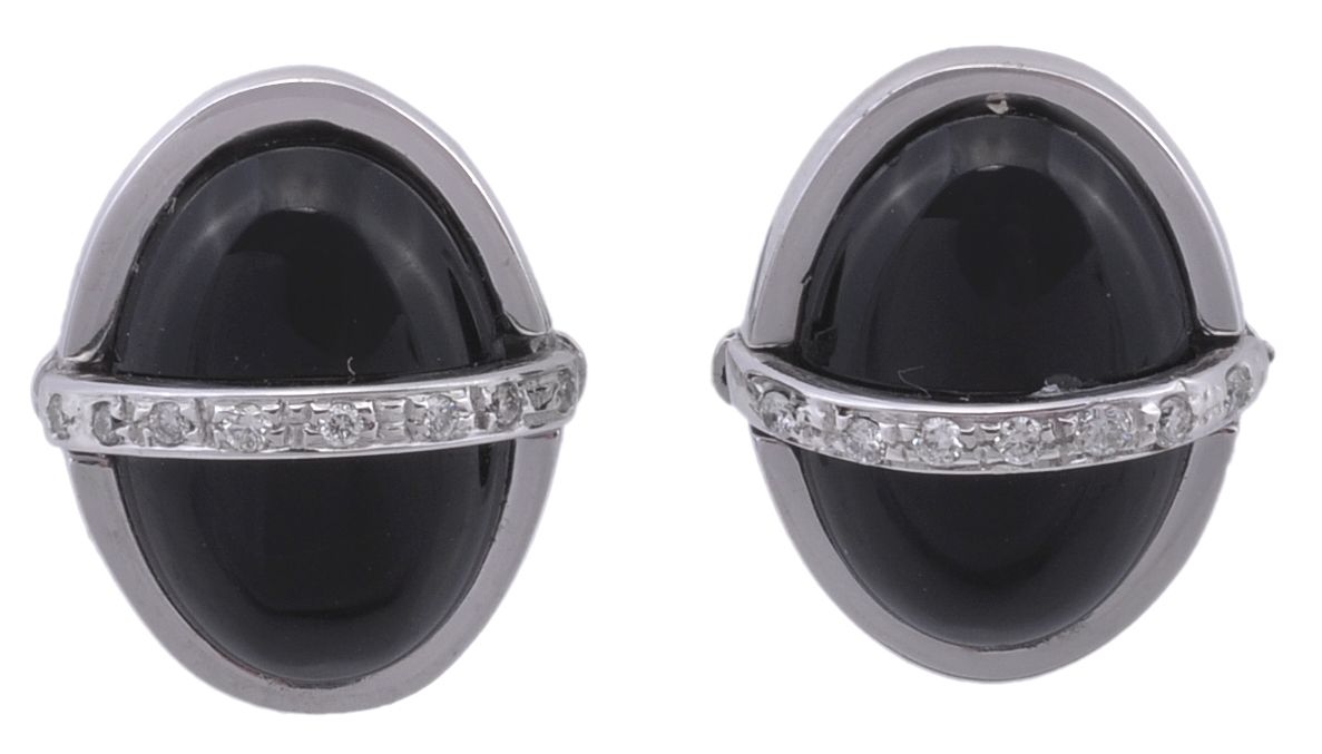 A pair of diamond and onyx cufflinks , the oval cabochon onyx panels with a...  A pair of diamond