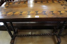 A Victorian walnut and geometric inlaid table on bobbin turned uprights joined by an H-stretcher