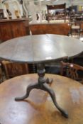 A George III oak provincial tripod table. Best Bid