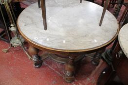 Circular marble top table on six bulbous column supports. (marble a.f.) Best Bid