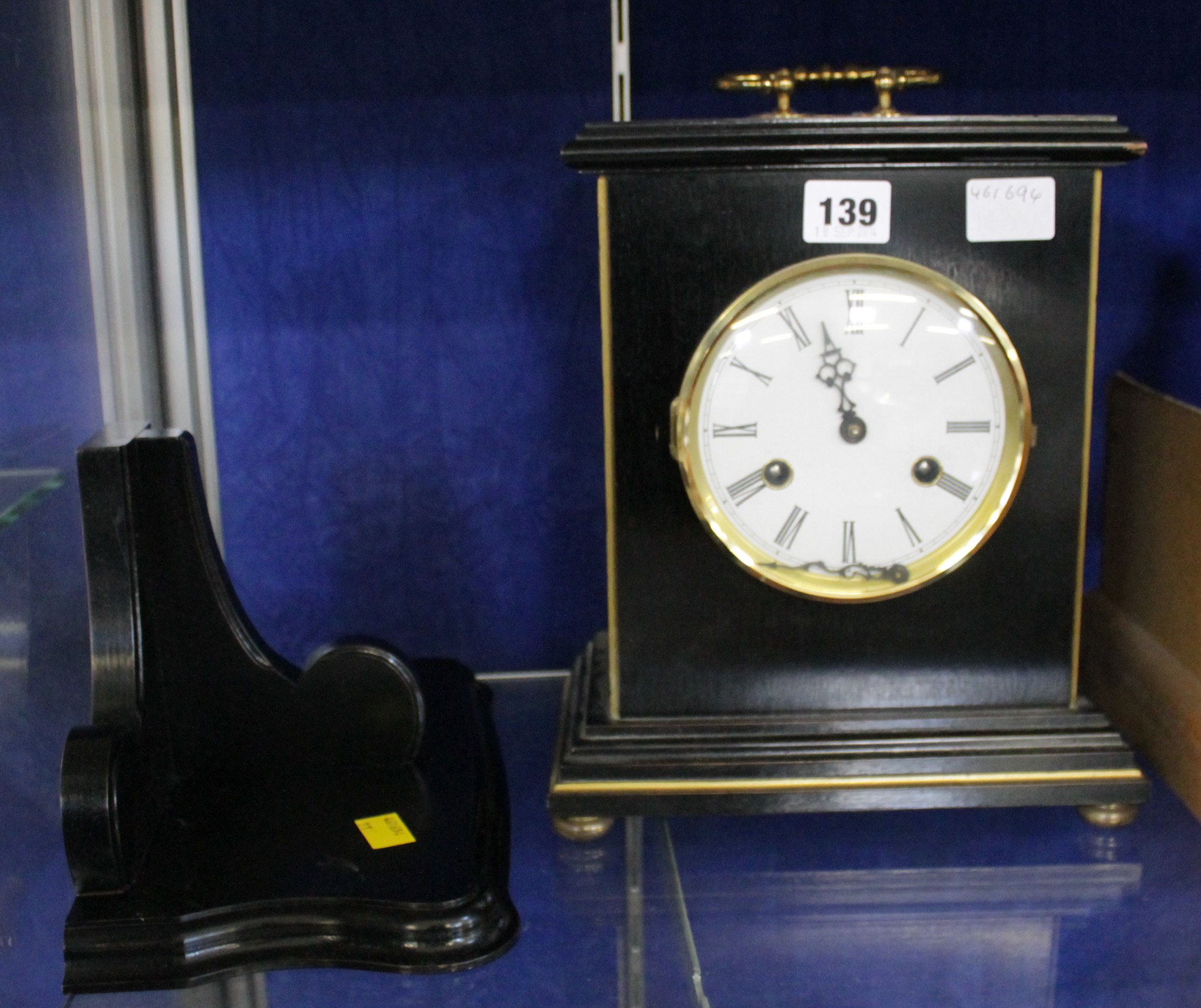 An ebonised bracket clock, late 20th century, the eight-day bell striking movement with circular