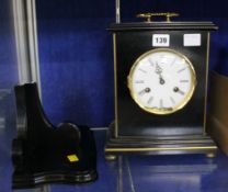 An ebonised bracket clock, late 20th century, the eight-day bell striking movement with circular