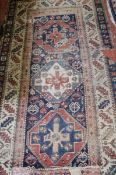 A Persian style rug 210 x 205cm, together with another rug