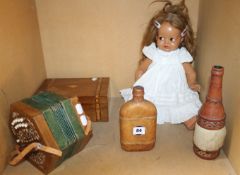 A mid 20th Century child?s doll, a squeezebox, a Tunbridge banded box and two drinks bottles.
