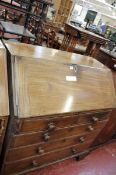 19th century y fallfront bureau with fitted interior with drawers below.
